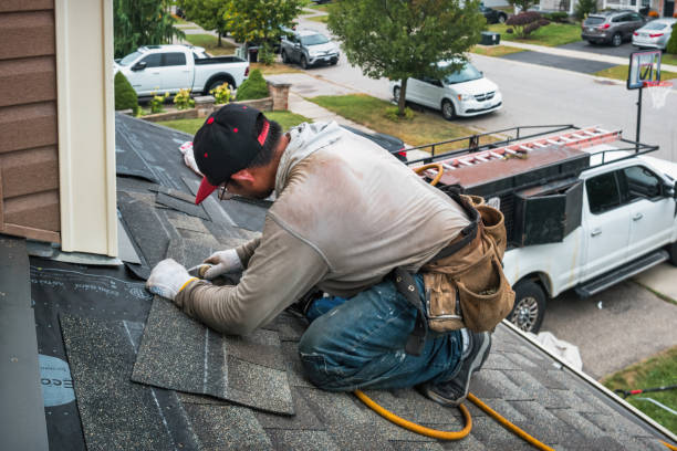 Professional Roofing technician working in Lisle, NY